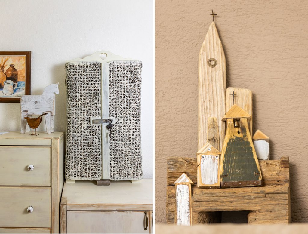 ručne vyrobená skrinka s vypletanými dvierkami a ručne vyrobené kostolíky zo zvyškov dreva